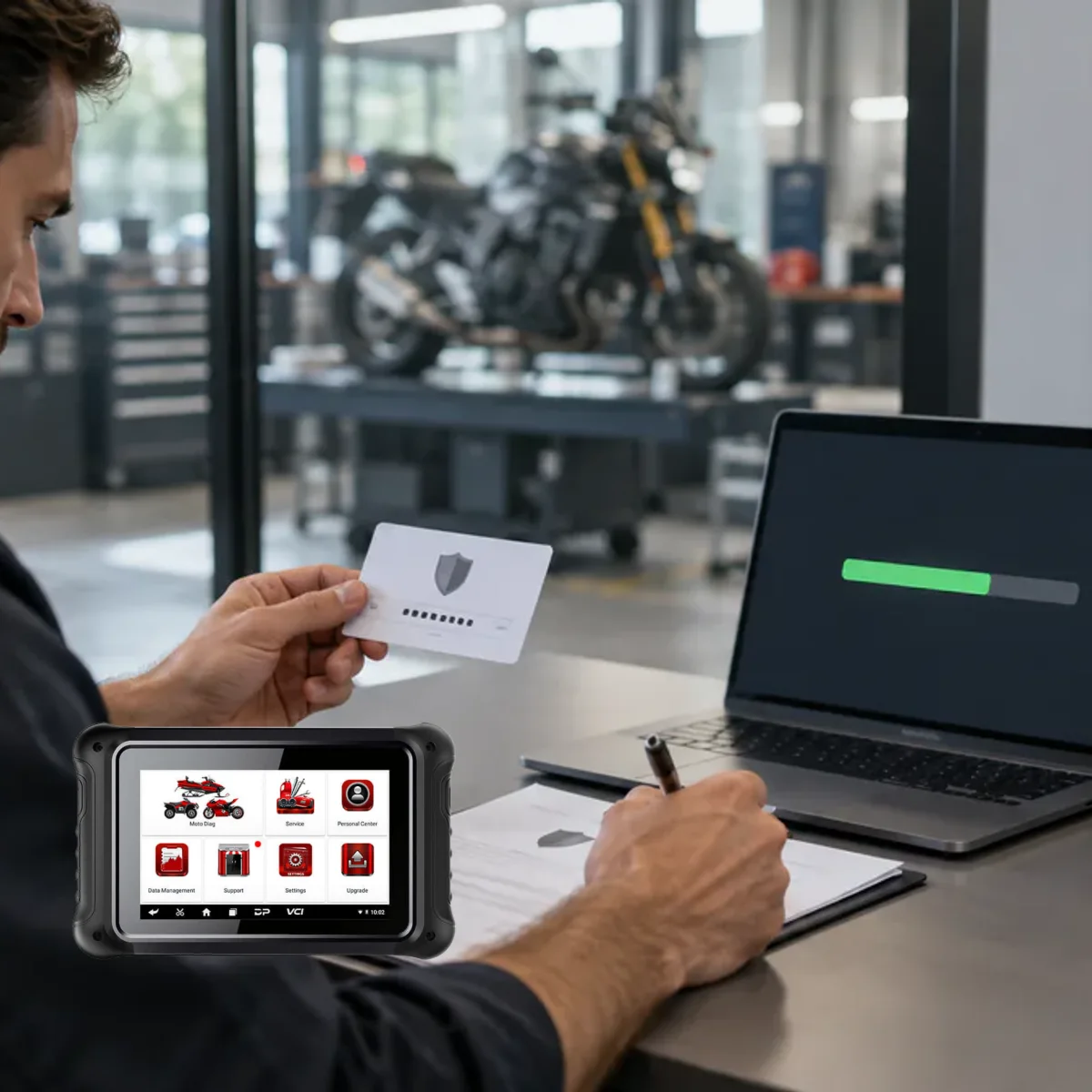 Technician verifying software renewal with license card and masked serial registration in a motorcycle workshop